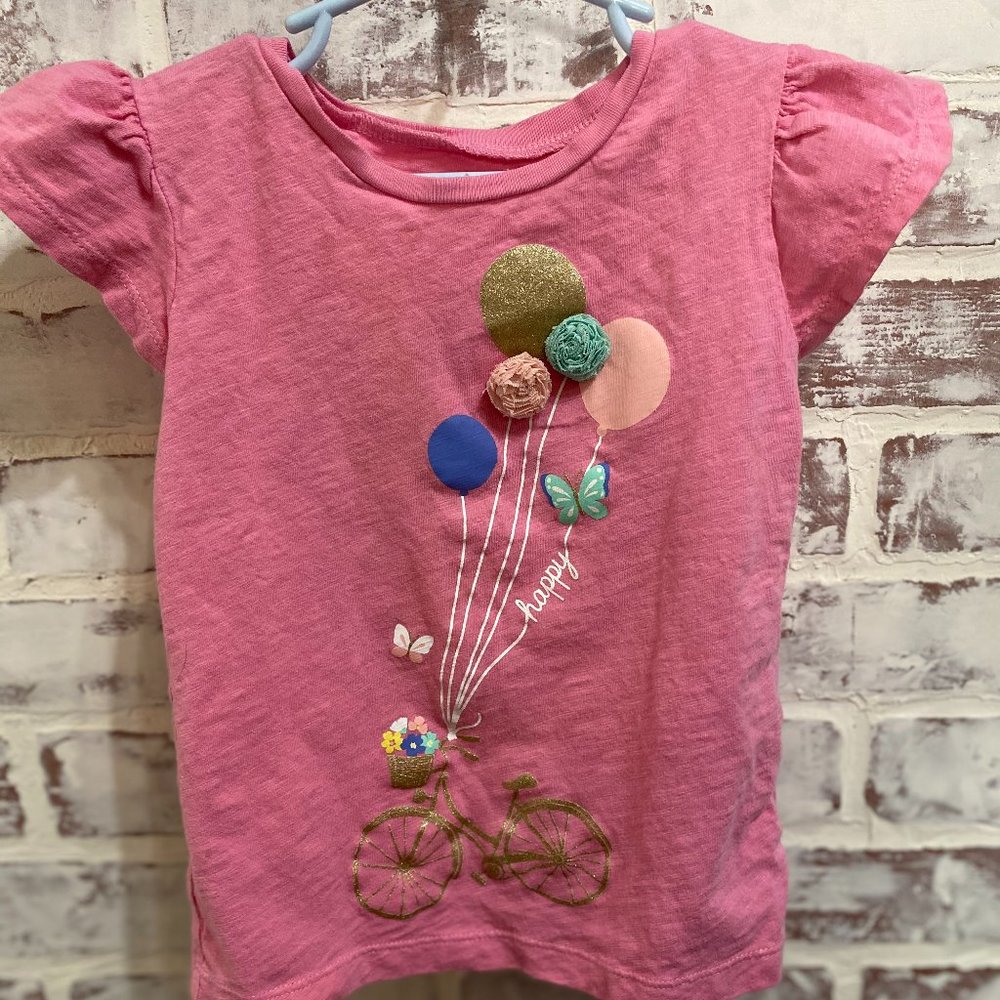 Pink T shirt with happy balloons
